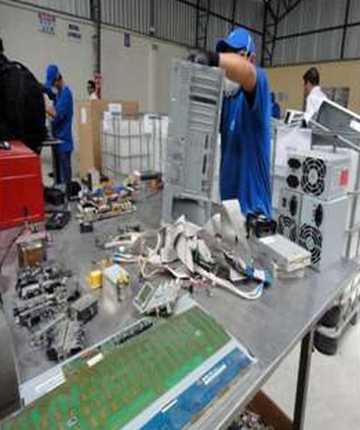Dismantling of electronic equipment to separate its recyclable components.