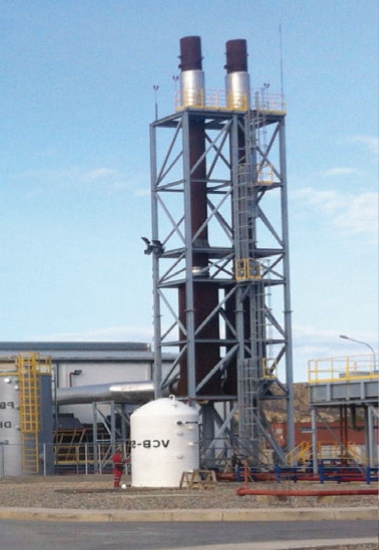 San Francisco plant: exhaust stack tower and white storage tank.