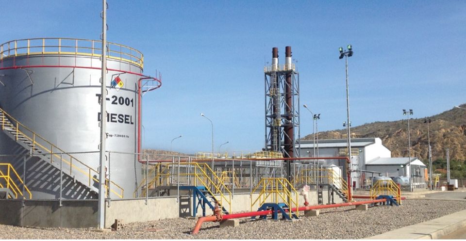 Diesel tank T-2001 next to the stack tower and the plant building.